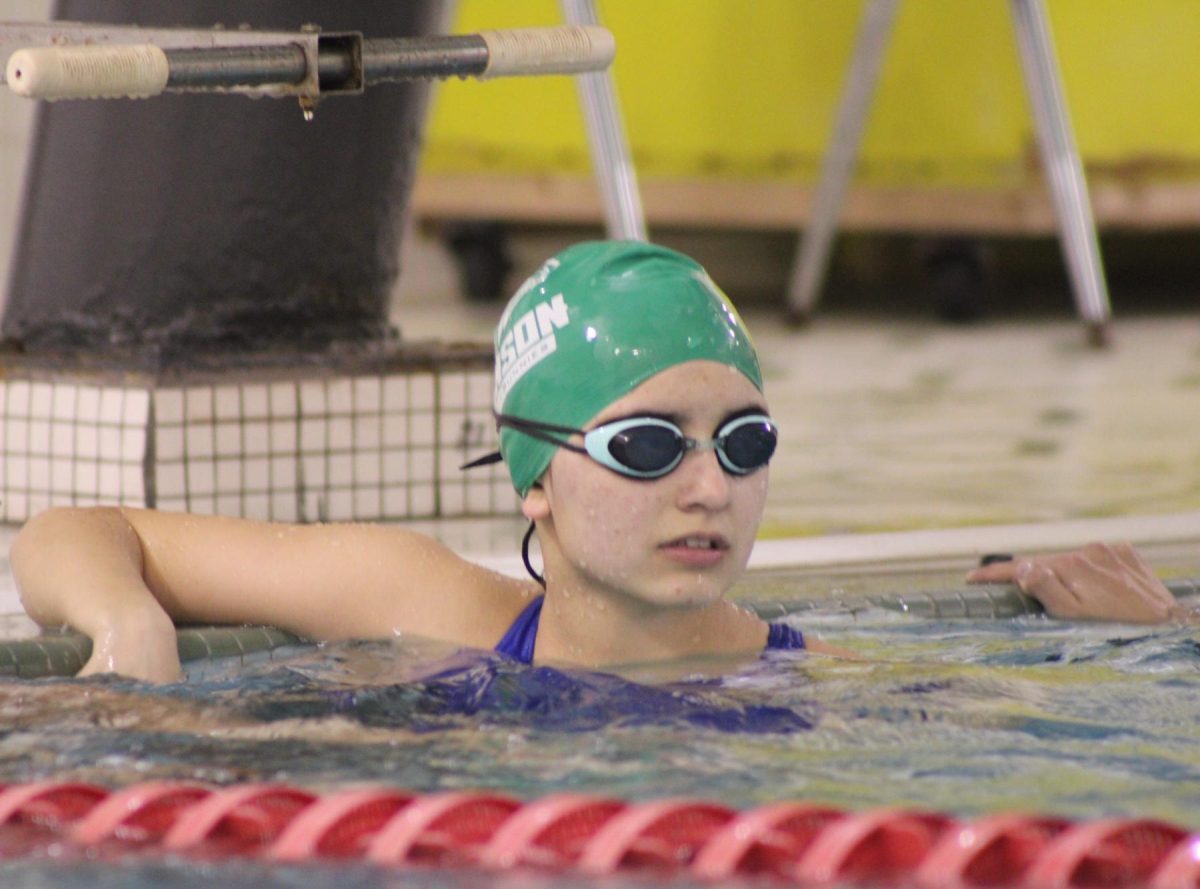 Senior Maya Coleman takes a breather while participating in swim team practice.