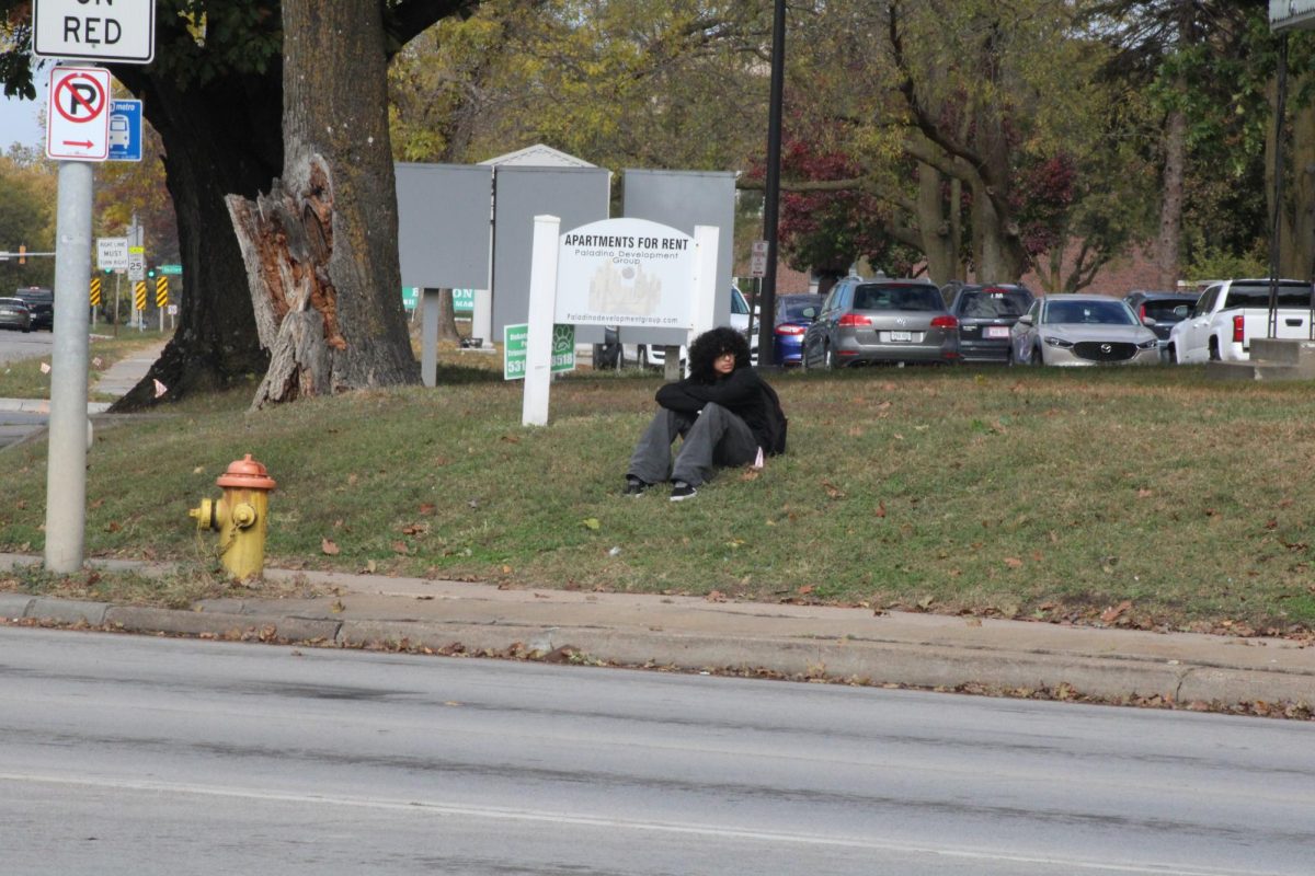 Student waits for a ride following the school day.
